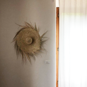 straw wall hat hanging provides additional benefits , like being stylish on the wall for a bohemian design or a keepsake item for an occasion